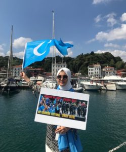 Dilnur Kroren with East Turkistan Flag